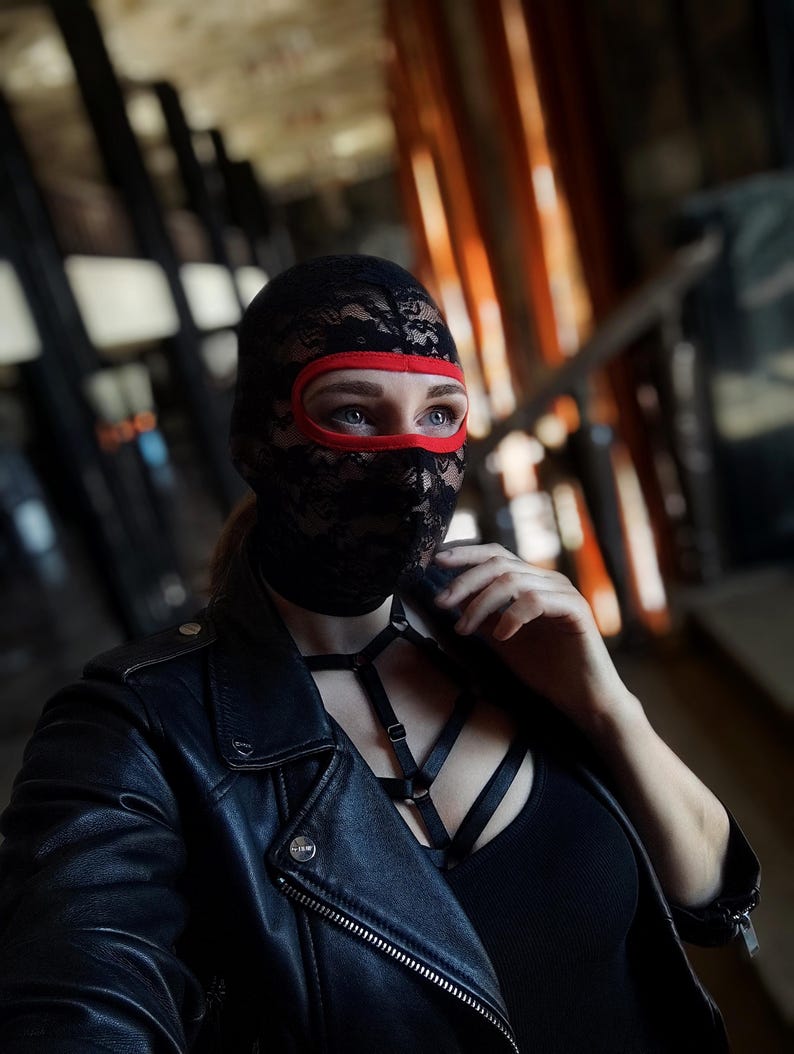 Handmade black and red lace mask, only revealing the eyes.78