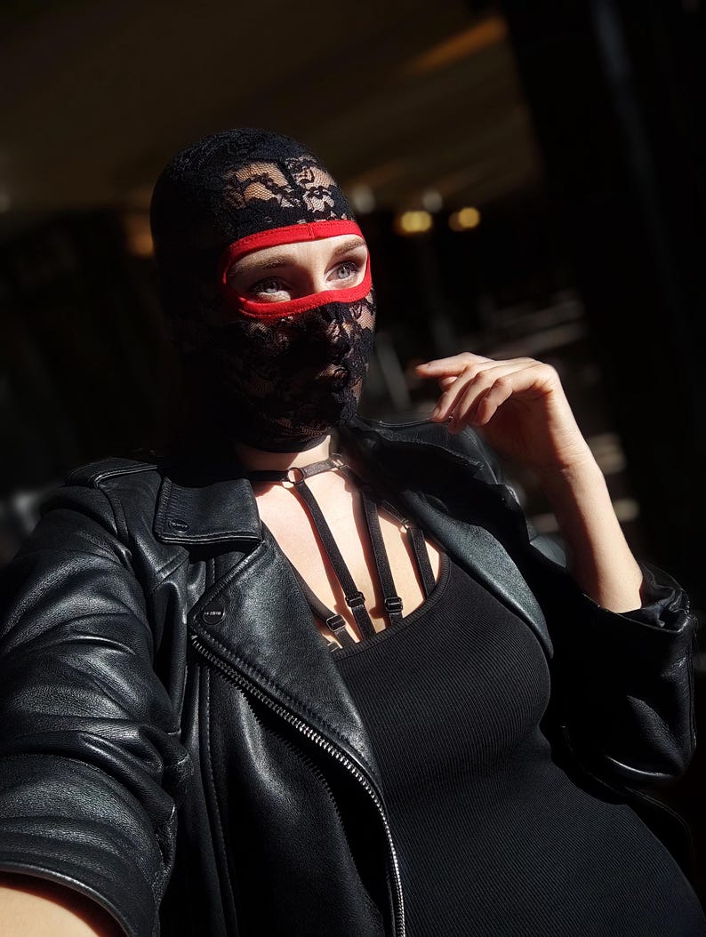 Handmade black and red lace mask, only revealing the eyes.78