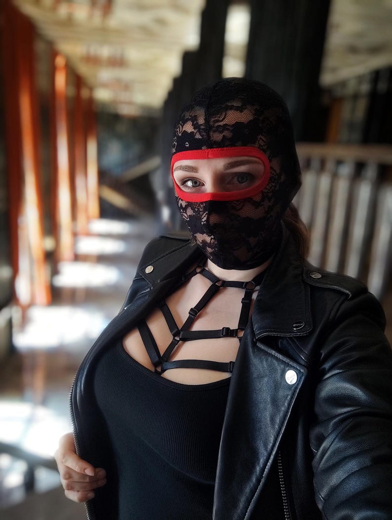 Handmade black and red lace mask, only revealing the eyes.78
